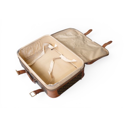 25 - A LOUIS VUITTON CASE, with monogrammed exterior and leather fittings . Distressed. 43 x 59 x 20 cms... 