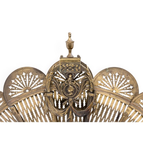 15 - A VINTAGE 'PEACOCK' FOLDING FIRE GUARDwith nine pierced fan panels emanating from a central swag dec... 