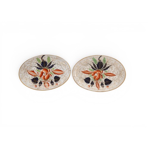 18 - A COALPORT IMARI PATTERN PART DESSERT SERVICE comprising an oval comport, side dishes and plates and... 