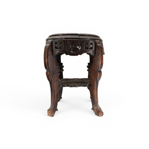 28 - A CHINESE HARDWOOD CIRCULAR VASE STAND with carved frieze and a quantity of other stands, another wi... 