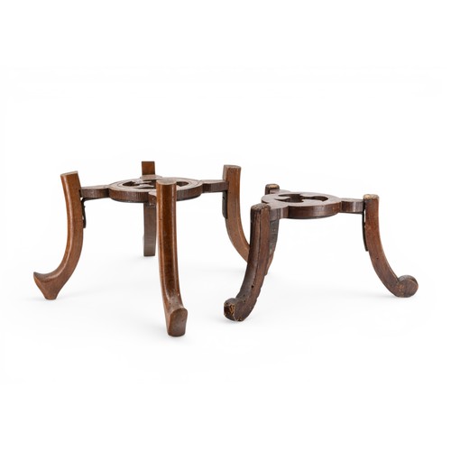 28 - A CHINESE HARDWOOD CIRCULAR VASE STAND with carved frieze and a quantity of other stands, another wi... 