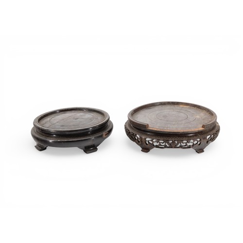 28 - A CHINESE HARDWOOD CIRCULAR VASE STAND with carved frieze and a quantity of other stands, another wi... 