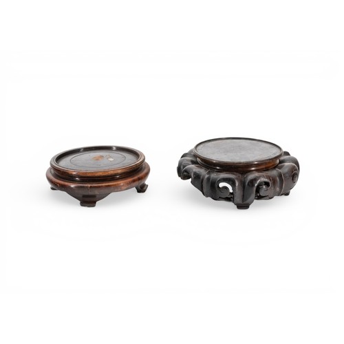 28 - A CHINESE HARDWOOD CIRCULAR VASE STAND with carved frieze and a quantity of other stands, another wi... 
