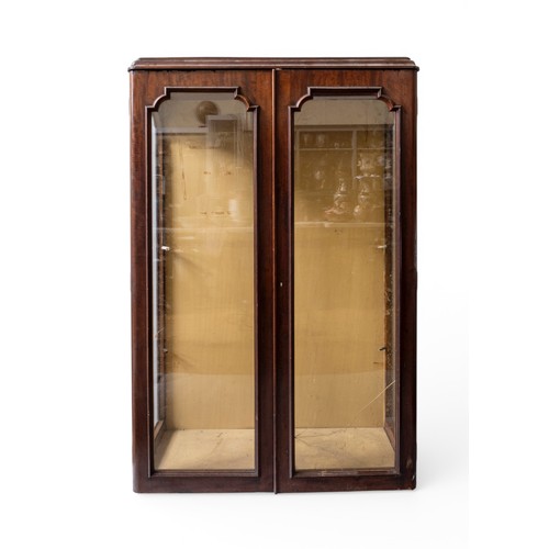 39 - A MAHOGANY TWO DOOR VETRINEogee cornice over twin cabinet doors with moulded arch panes153 x 101 x 4... 