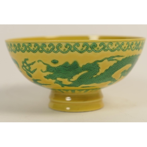 58 - Chinese green and yellow dragon bowl, incised with two dragons chasing flaming pearls, within  lappe... 