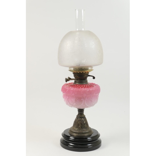 444 - Late Victorian pedestal oil lamp, the mushroom shaped shade frosted and etched with baskets of flowe... 