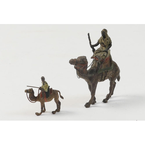 456 - Austrian cold painted bronze figure of a bedouin riding a camel, circa 1900, 7cm; also a smaller ver... 