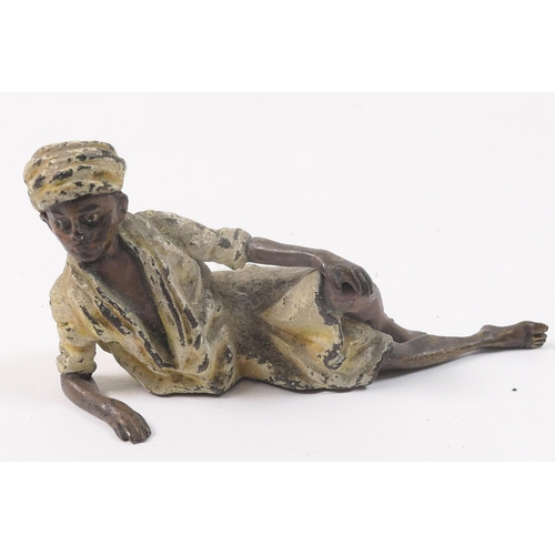 457 - Austrian cold painted bronze figure of a reclining nomad, circa 1900, marked 'Geschutz' and numbered... 