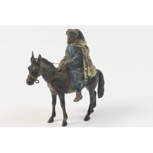 458 - Austrian cold painted bronze figure of a nomad on an ass, circa 1900, 6.5cm