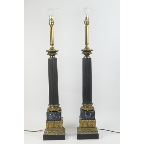 463 - Pair of decorative metal and brass column table lamps, black painted fluted column on a faux marble ... 