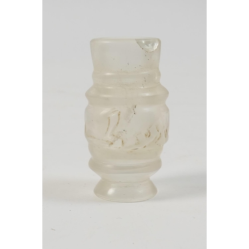 478 - Carved rock crystal bottle, in the Fatimid style, having a central band of kufic script, height 6.3c... 