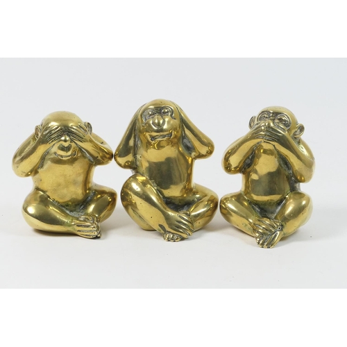 496 - Three polished brass monkey ornaments, 'Hear no evil, speak no evil, see no evil', height 12.5cm