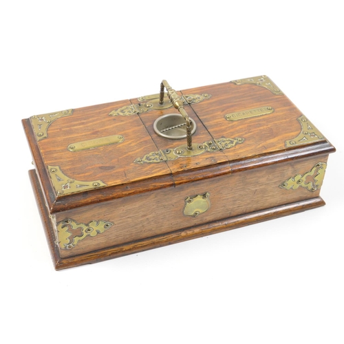 501 - Victorian oak and brass mounted smoker's box, centred with a carrying handle, and with two lift up l... 