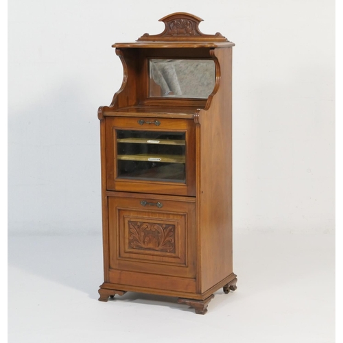 541 - Late Victorian mahogany music cabinet, circa 1890, having an upper shaped shelf over a bevelled glas... 