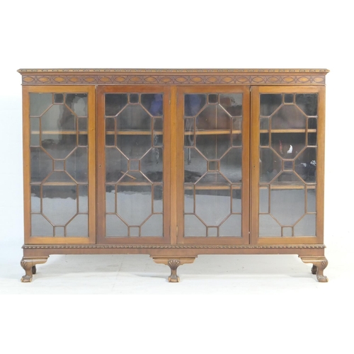 557 - Chippendale Revival mahogany bookcase, circa 1900-10, having a blind fretwork frieze over four astra... 