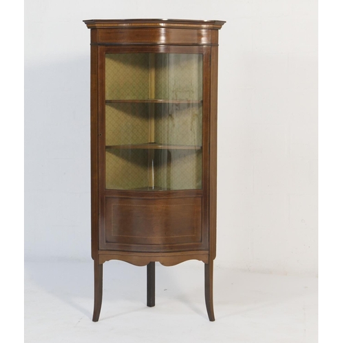 563 - Edwardian mahogany and inlaid free standing corner display cabinet, serpentine front with dentil inl... 