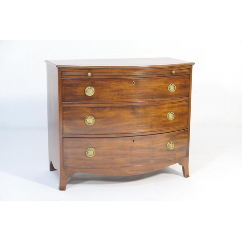 568 - Late Regency mahogany bow front bachelor's chest, circa 1830, having a brushing slide over three gra... 