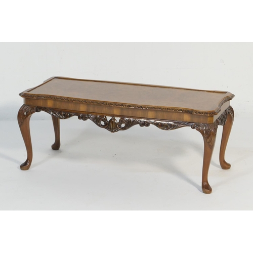 570 - Burr walnut carved coffee table, shaped rectangular form raised on acanthus carved cabriole legs wit... 