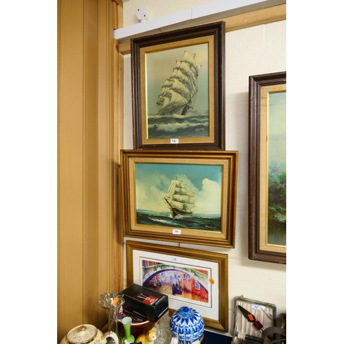 74 - Two modern framed oil paintings of galleons; also modern framed, limited edition, print 