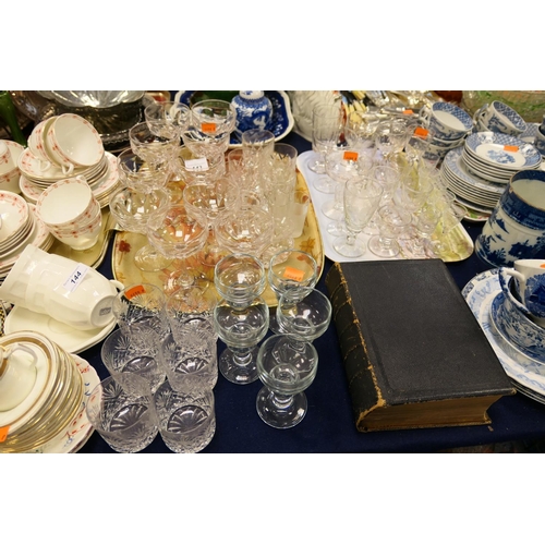 143 - Ten quality glass champagne coupes, other pedestal glassware and a William Collins Bible