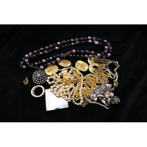 468 - Mixed costume jewellery including beaded necklaces, simulated pearls, motoring badges etc