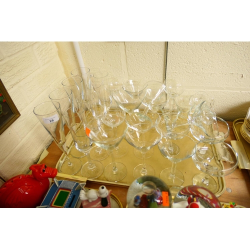 28 - Modern pedestal glass wares including champagne flutes and martini glasses