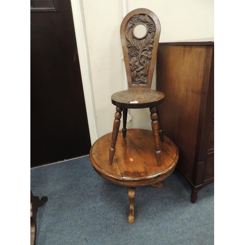 628 - Victorian carved oak spinning chair dated 1902, also a small walnut circular coffee table (2)