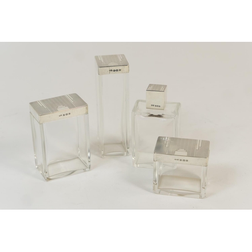 161 - Four Art Deco silver topped bottles, by Deakin & Francis, Birmingham 1934, each of plain form, the c... 