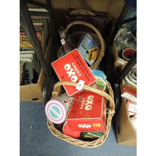 69 - Two carrying baskets, handbag, buttons and vintage tins including Oxo cubes