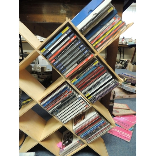 105 - Metal framed CD tower; also a wooden framed CD tower containing mainly classical CDs