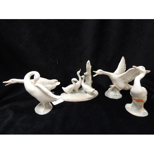 276 - One Nao and three Lladro goose figurines; also a Lladro swan figurine (5)