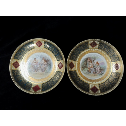 281 - Pair of Austrian gilt printed plates featuring Carl Lasseny prints of 'Sapphire' and 'Emerald'