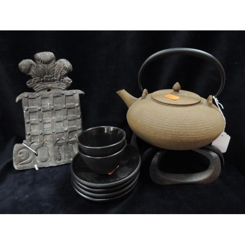 338 - Modern Japanese patinated iron teapot on stand; also a cast lead fire mark and a small number of Jap... 