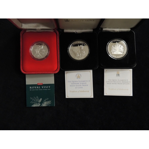 487 - Queen Elizabeth II royal commemorative silver proof £5 coin; also a Sapphire Jubilee silver proof £5... 