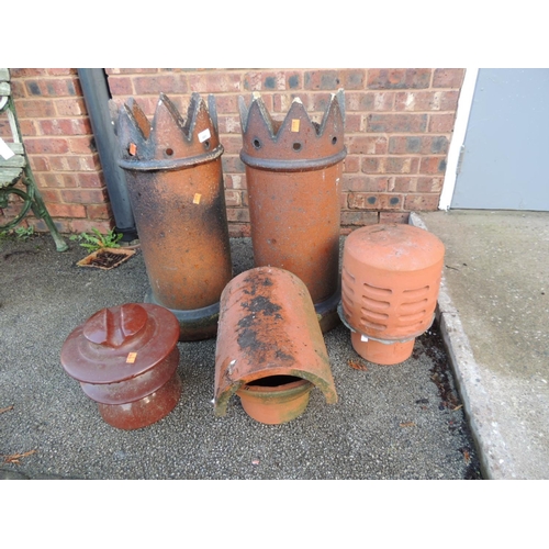 881 - Two salt glazed chimney pots and two terracotta chimney pot covers and an electrical insulator (5)