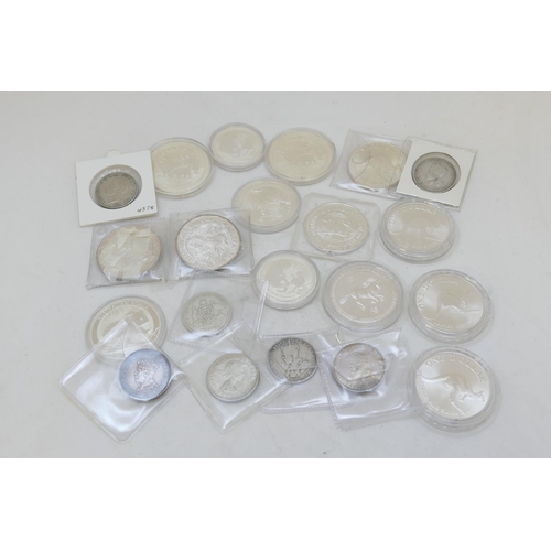 73 - Eleven Australian silver dollars, each weighing 1 troy oz; also two silver 50 cent coins, each 1/2 t... 