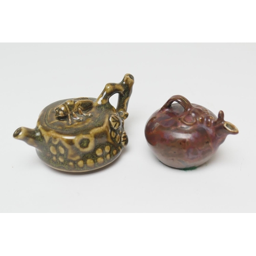 65 - Flambe glazed gourd form water dropper, 6cm; also a treacle glazed water dropper in the form of a te... 