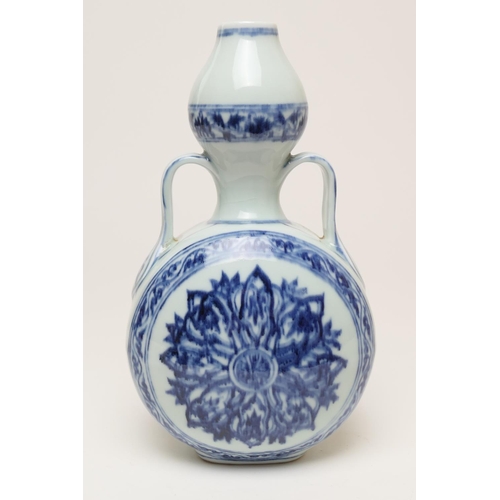 71 - Chinese blue and white bottle vase in the Ming style, 20th Century, flattened double gourd form deco... 