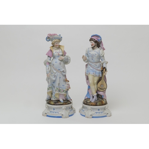 75 - Pair of French coloured bisque figures of courtiers, circa 1900, decorated throughout with colours, ... 