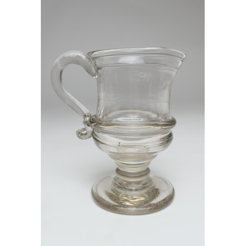 79 - Heavy blown glass pedestal jug, circa 1780, with a folded rim and slightly waisted body over a blade... 