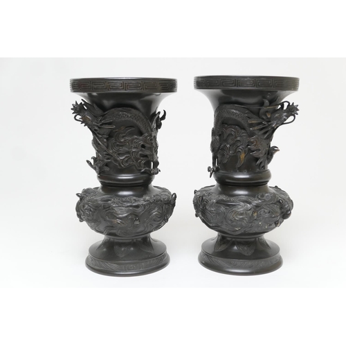 610 - Pair of Japanese bronze vases, Meiji (1868-1912), baluster form with trumpet neck, decorated with dr... 