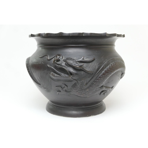 611 - Japanese bronze jardiniere, Meiji (186-1912), cast with a single dragon flying amidst clouds, beneat... 