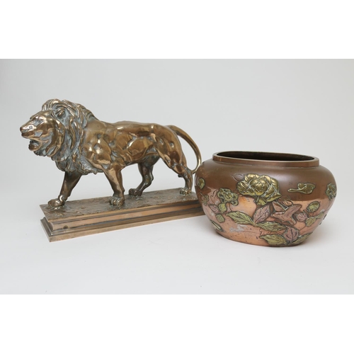 654 - After Barye, a polished bronze sculpture of a lion, the base bearing a signature, height 26cm, lengt... 