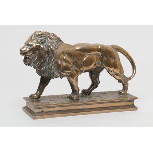 654 - After Barye, a polished bronze sculpture of a lion, the base bearing a signature, height 26cm, lengt... 