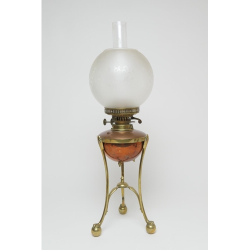 661 - W.A.S. Benson, brass and copper oil lamp, with a frosted spherical shade, copper tank over a brass t... 