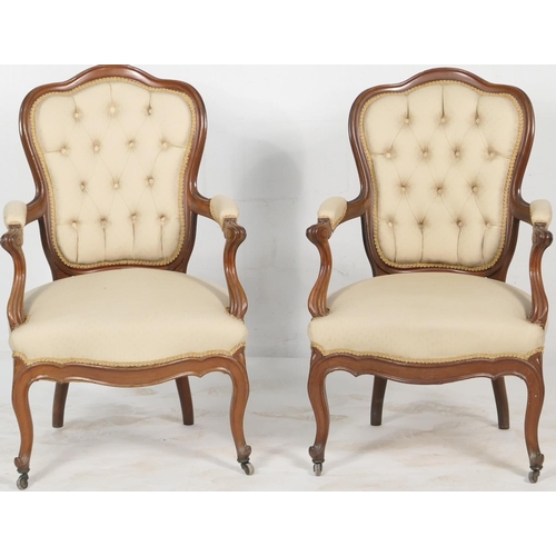 692 - Pair of French walnut and upholstered armchairs, deep buttoned upholstered back in beige fabric, pad... 