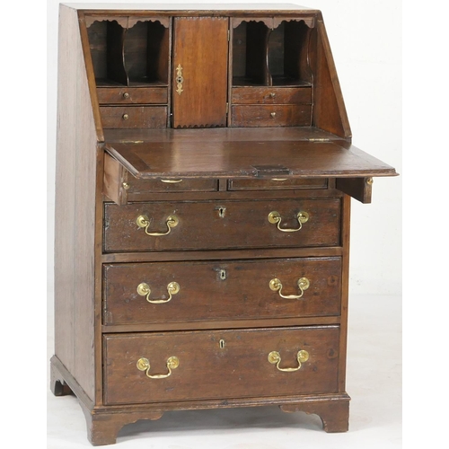 697 - Small oak bureau, 19th Century conversion, having a slope front opening to an interior with cupboard... 