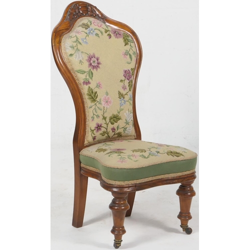 700 - Victorian carved walnut and needlework upholstered nursing chair, having a trefoil shaped back carve... 