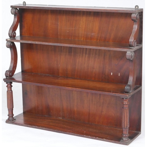 772 - George IV mahogany wall shelf, circa 1825, waterfall form on reeded scroll brackets, the lower shelf... 