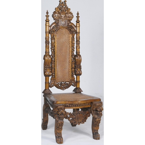 781 - Continental baronial style carved walnut hall chair, having a high back with double cane bergere ben... 